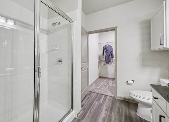 bathroom with toilet at Vine + Vail Townhomes and Apartments, Grapevine Texas
