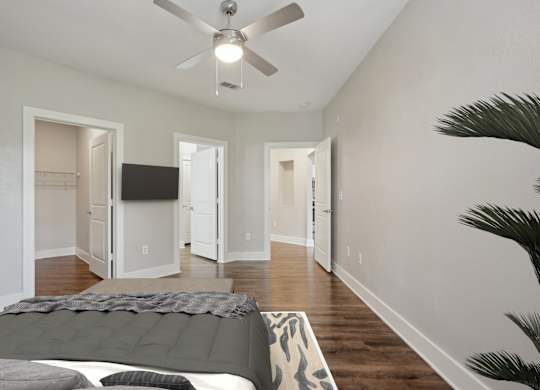 Spacious bedroom with vaulted ceiling and multiple doorways at Highline Urban Lofts Apartments, Cypress