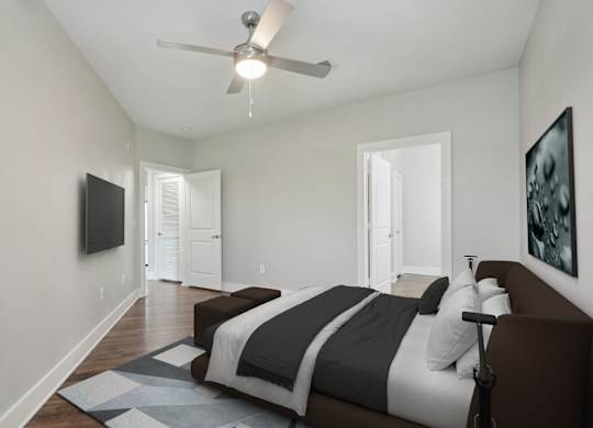Modern bedroom with ceiling fan and platform bed at Highline Urban Lofts Apartments, Cypress, 77429