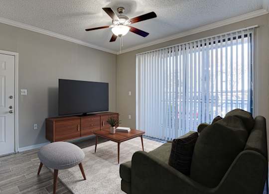 Living room with tv stand and vertical blinds at Carmel Creekside Apartments, Fort Worth