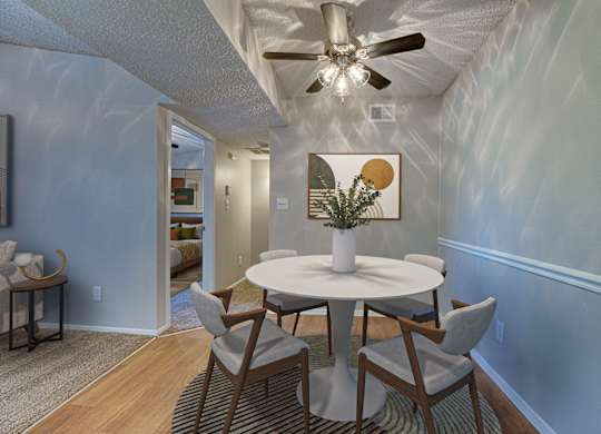 A dining room with a white table and chairs at Indian Creek Apartments, Carrollton, TX, 75007