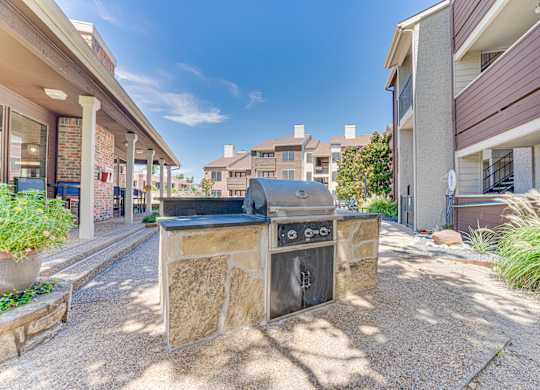 stone fireplace with surrounded building at Timberglen Apartments, Dallas, 75287