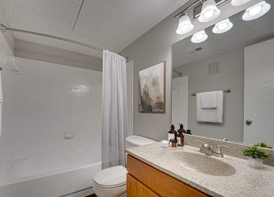 bathroom with white bathtub at Timberglen Apartments, Dallas, TX 75287