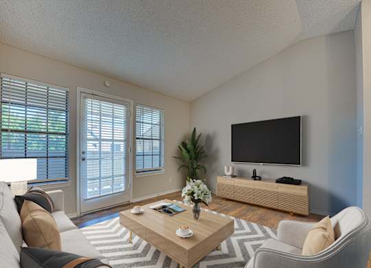 Spacious living room with TV at Timberglen Apartments, Dallas