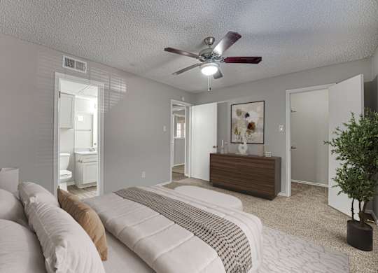 bedroom with dresser, and mirror at Timberglen Apartments, Dallas Texas