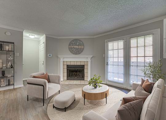 living room with a fireplace at Timberglen Apartments, Dallas