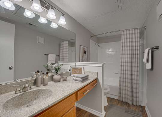 Bathroom with sink, toilet and bathtub at Timberglen Apartments, Dallas, 75287