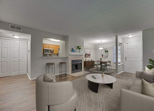Grey couches in living room at Timberglen Apartments, Dallas, TX 75287
