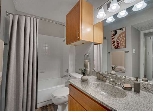 Grey curtain in bedroom at Timberglen Apartments, Dallas
