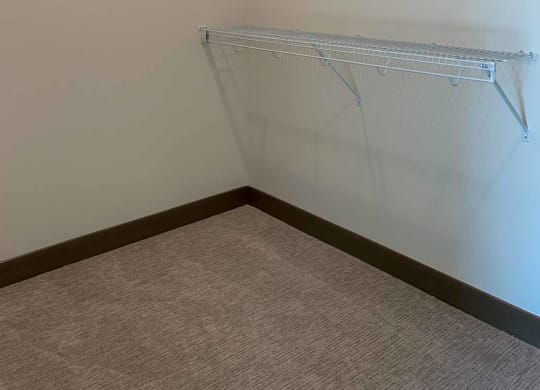 a walk-in closet with built-in shelves and hanging space