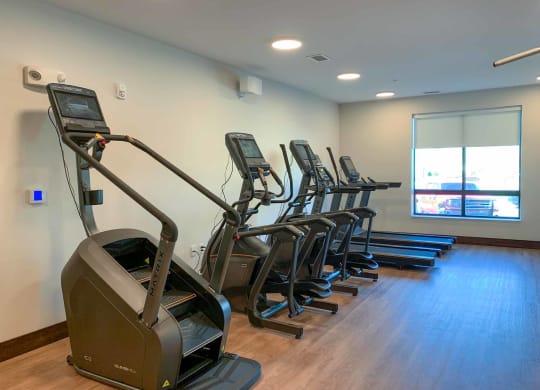 The fitness center with treadmills, ellipticals, and a Stairmaster