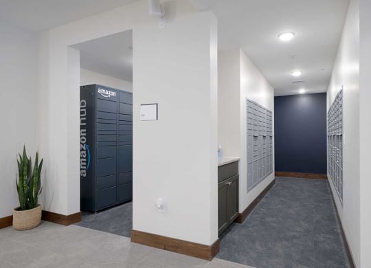 a mail room with mailboxes and amazon lockers