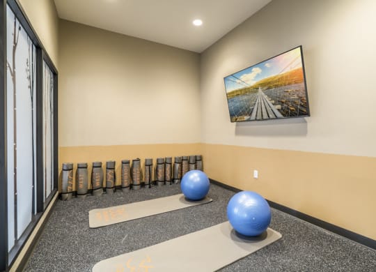 Yoga room with on-demand classes at 360 at Jordan West best new apartments West Des Moines IA 50266