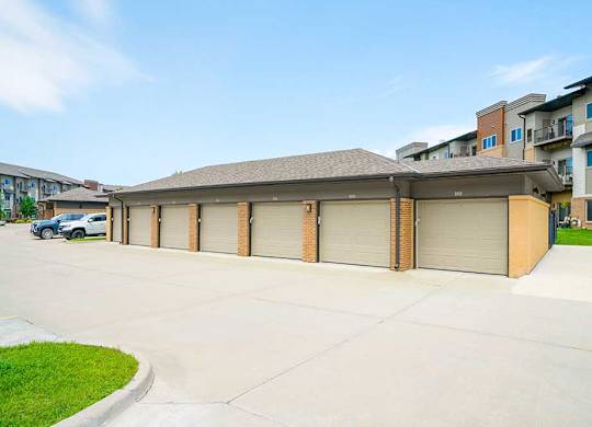 A row of private detached garages for additional storage or covered parking.