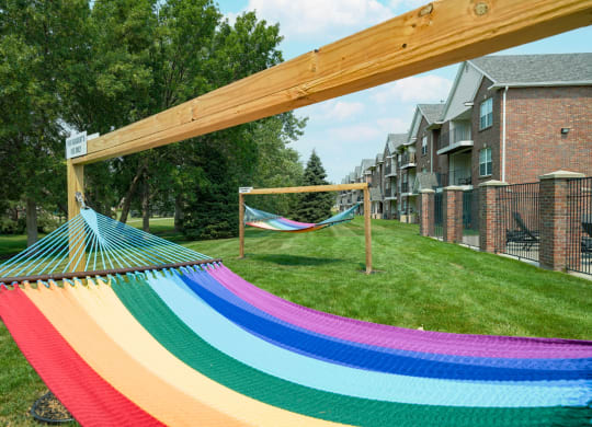 rainbow striped hammock outside the clubhouse at Williamsburg Park apartments in Lincoln