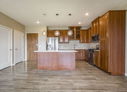 Ascend at Woodbury premium three-bedroom apartment with quartz countertops in kitchen