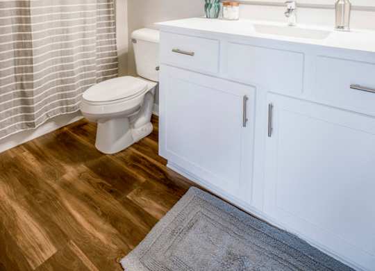 Bathroom with white cabinetry at Ascend at Woodbury new luxury apartments in Woodbury MN 55129