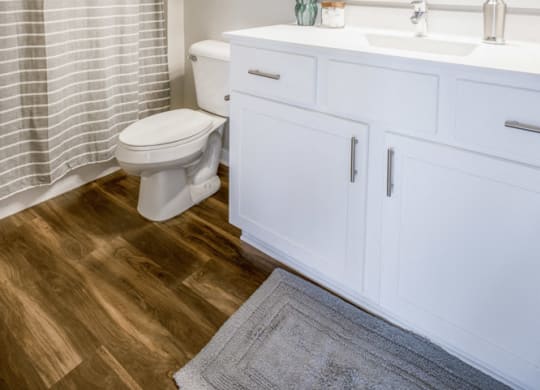 Bathroom with white cabinetry at Ascend at Woodbury new luxury apartments in Woodbury MN 55129