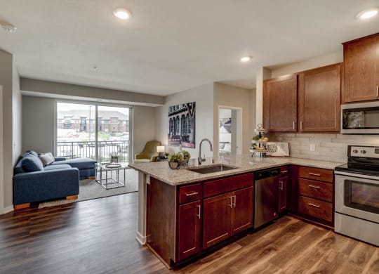 Luxury apartment with dark cabinetry and granite countertops at Ascend at Woodbury MN 55129 new luxury apartments