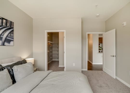 Bedroom with walk-in closet at Ascend at Woodbury in Woodbury MN
