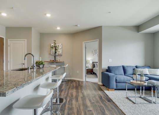 Open floor plan with kitchen, dining and living room at Ascend at Woodbury MN 55129 new luxury apartments
