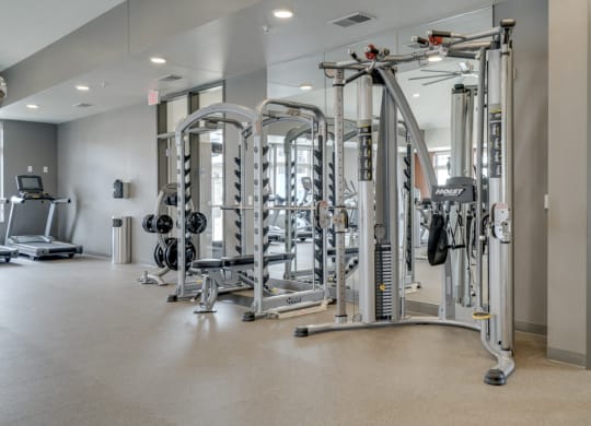 Large fitness center with free weights, weightlifting machines and cardio equipment at Ascend at Woodbury in MN