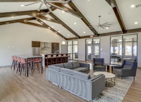Clubhouse with seating and deluxe kitchen for entertaining at Ascend at Woodbury new luxury apartments in Woodbury MN 55129