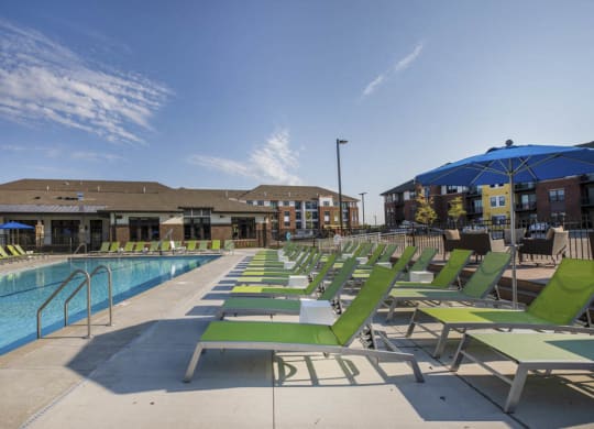 Lounge chairs next to resort-style pool at Ascend at Woodbury new luxury apartments in Woodbury MN 55129