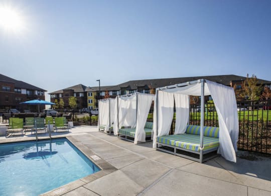 Pool with resort-style cabana seating at Ascend at Woodbury new luxury apartments in Woodbury MN 55129