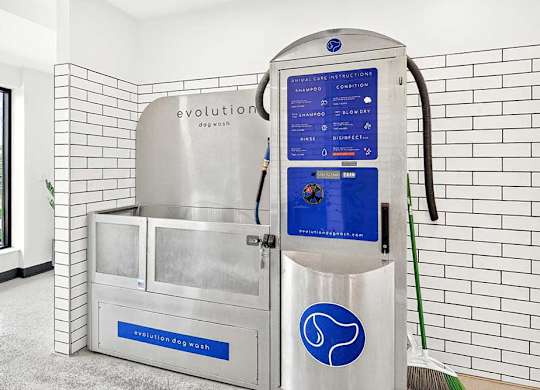 A stainless steel sink with a blue sign that says