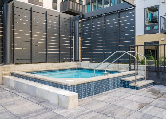 Square spa hot tub with walk in stairs at luxury apartment in Woodbury MN 55125