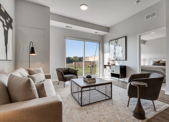 Living space with warm brown floors in luxury apartment Woodbury MN 55125
