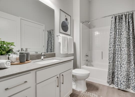 Bathroom with light counters and cabinets at luxury apartments in Woodbury MN 55125