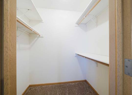 a walk in closet in the primary bedroom of the Ponderosa duplex