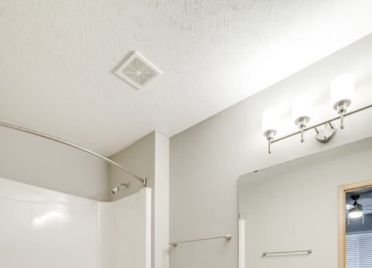Bathroom with white cabinetry at Cascade Pined Duplex and townhomes