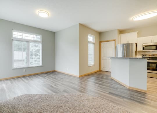 Open floor plan with kitchen and living room at Cascade Pines Duplex and townhomes