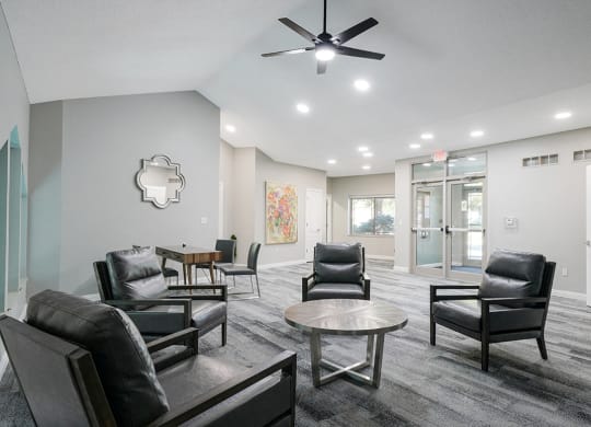 chairs and a table in the waiting area of the front office at Southwind Villas in La Vista, NE
