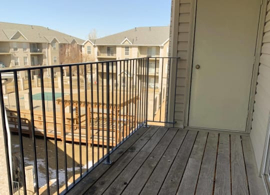 balcony overlooking community swimming pool at Eagle Run Apartments in Omaha Nebraska