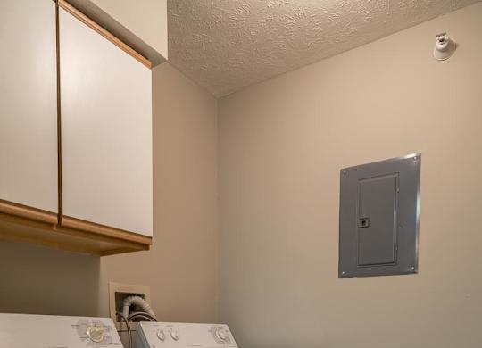A white washer and dryer in a small laundry area.