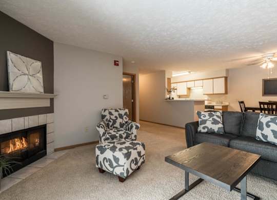 A living room with a fireplace and a couch.