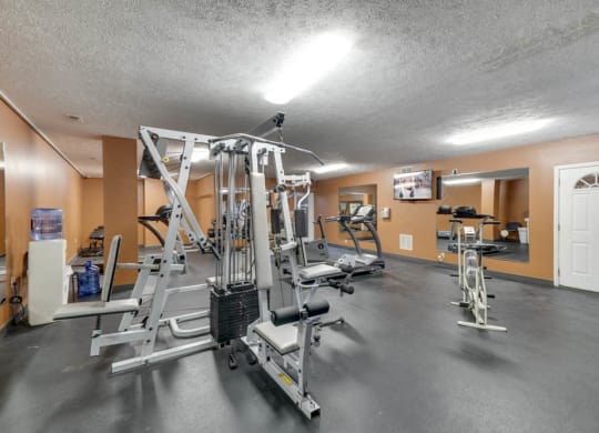 Fitness center with weightlifting machines and cardio equipment at Eagle Run Apartments in northwest Omaha 68164