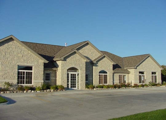 Clubhouse exterior landscaping at Stone Ridge Estates Apartments in Lincoln Nebraska