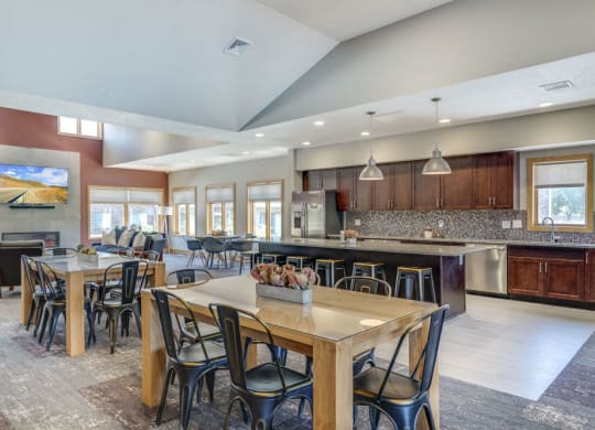 Clubhouse with seating and kitchen for resident's use at Fountain Glen Apartments