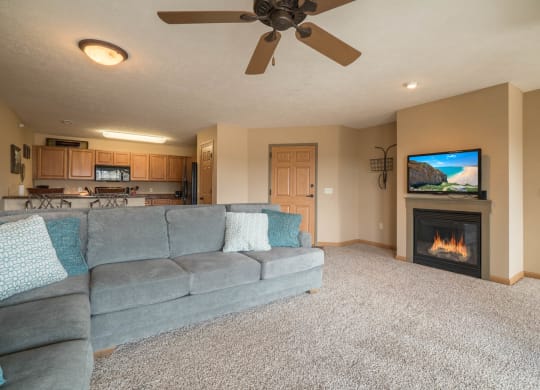 a living room with a couch and a fireplace