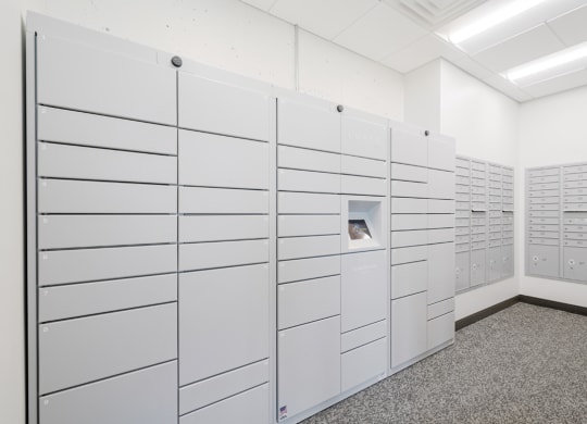 a row of white lockers in a white room