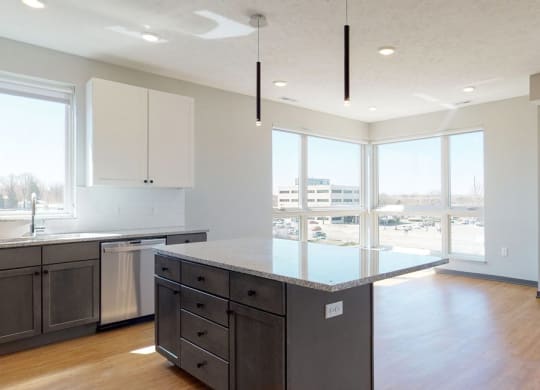 Open concept kitchen and living-dining space in the Shine floor plan at Haven at Uptown in Lincoln, NE