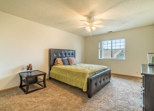 Bedroom with ceiling fan at The Northbrook Apartment Homes, Lincoln, NE