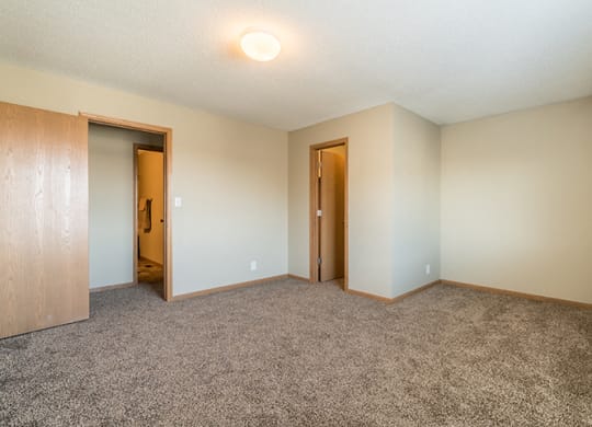 Bedroom with large walk in closet for extra storage at Skyline View Apartments in Lincoln NE