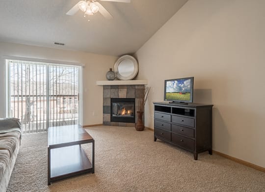 Cozy fireplace for extra warmth with patio at Pinebrook Apartments in Lincoln NE