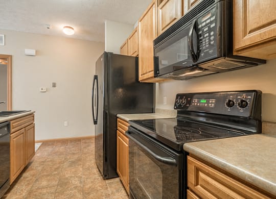 Interiors- Kitchen with flat-top stove at Stone Creek Villas Apartments in Omaha Nebraska